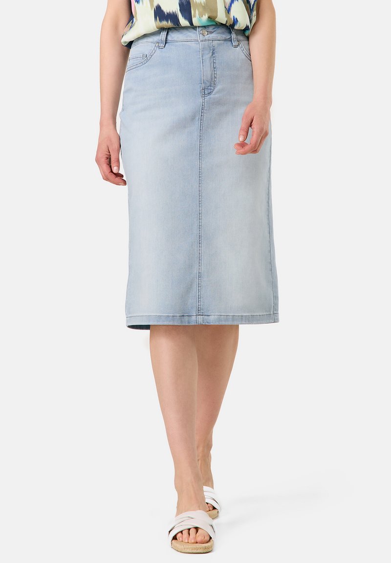Light blue denim midi skirt with a straight cut, front zipper, and pockets. Features a clean hem and slightly faded texture.