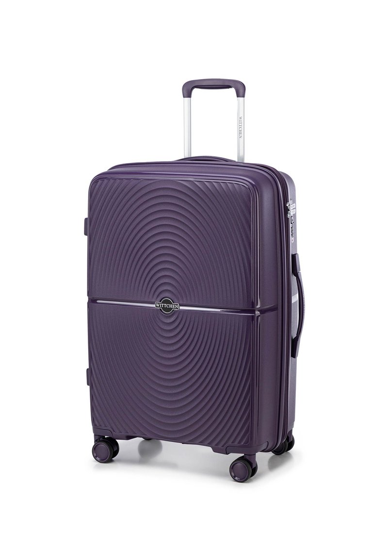 Valise rigide violette avec un motif ondulé texturé, poignée télescopique, roues doubles et une poignée de transport latérale. Logo de la marque affiché en évidence.