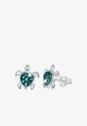 Boucles d'oreilles clous en argent en forme de tortue, ornées de cristaux teal en forme de cœur, avec des accents polis et un support à tige sécurisé.