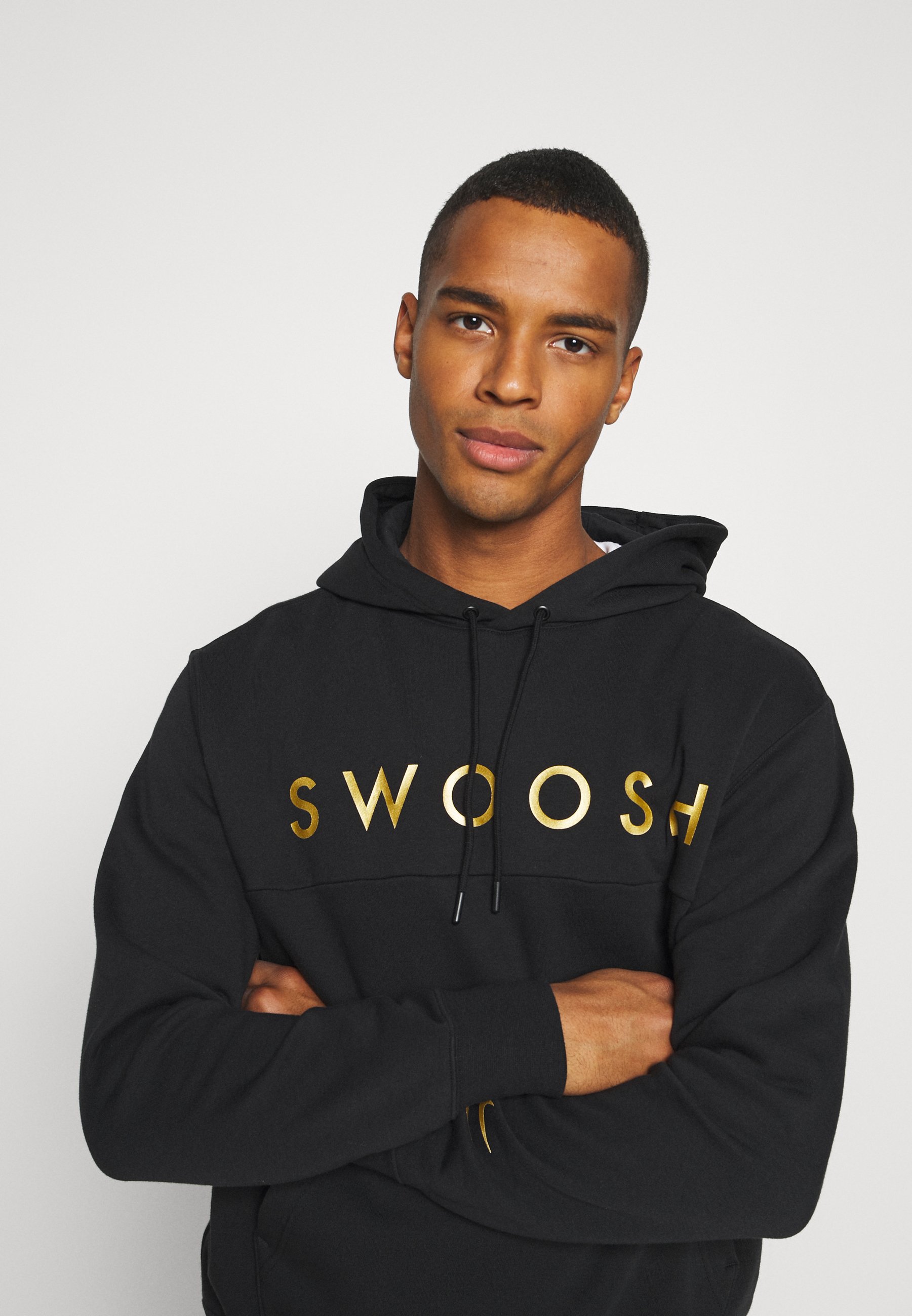 black and gold nike pullover