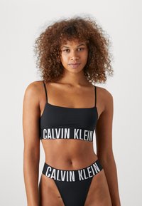 Calvin Klein Underwear - UNLINED BRALETTE - Bikini pezzo sopra - black Immagine in miniatura 1