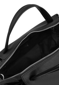 Black leather handbag with a textured surface, zippered closure, and dual handles. Interior is lined in black fabric.