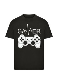 Black t-shirt featuring a white graphic of a game controller and heartbeat line, with the word "GAMER" integrated into the design.