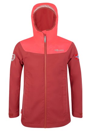 Red waterproof jacket with a bright pink upper section, hood, front zipper, and reflective accents. Features logo and flag patches on sleeves.