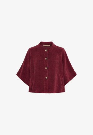 Bordeaux farvet tekstureret jakke med rund krave, fem knapper ned foran og brede ærmer. Blødt materiale med en hyggelig finish.