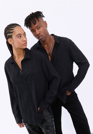 YOURTURN UNISEX - Pogājama blūze - black