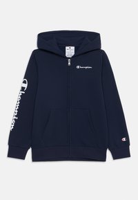 Tamno plava zip-up dukserica izrađena od pamučne mješavine. Ima kenguruh džep, logo na prsima i rukavu, te podstavljenu kapu.