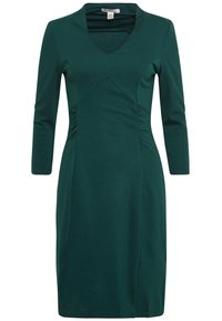 Robe vert foncé mi-longue, manches trois-quarts, encolure en V, avec de discrètes fronces à la taille.