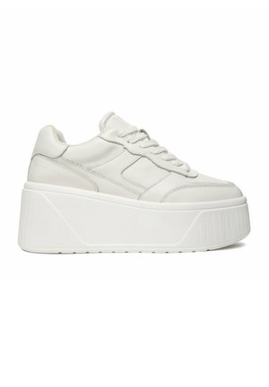 White platform sneaker with thick sole, lace-up design, and stitched panel details, shown in side profile on a plain background.