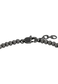 Bracciale a catena con perle nere lucide e chiusura a moschettone sicura, dotato di anelli di estensione per una misura regolabile.