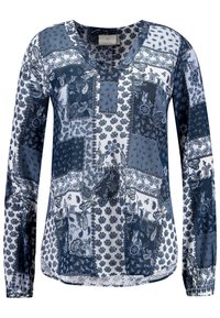 Blouse à manches longues et col en V, bleu et blanc, avec motifs patchwork de paisley et floraux. Tissu léger et fluide avec une coupe décontractée.
