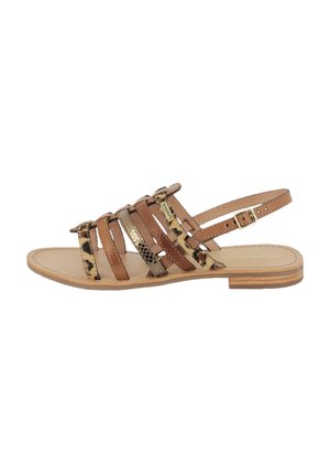 Strappy flat sandal featuring brown leather and animal print accents, with a buckle closure, open back, and a flat wooden sole.