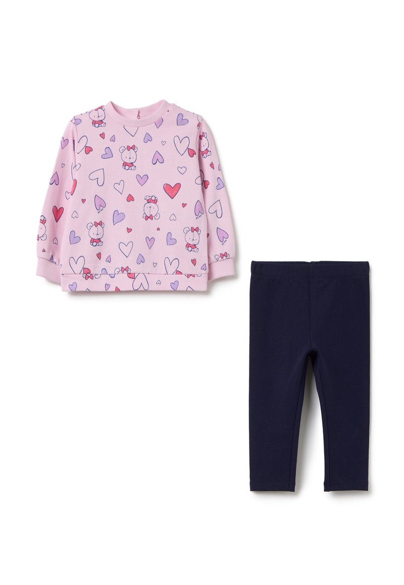 Camisa de manga larga rosa claro con personajes de dibujos animados y patrones de corazones, combinada con leggings elásticos sólidos de color navy. Tejido de algodón suave.