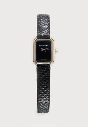 Ferragamo wristwatch with black rectangular face, silver-tone case, and textured black leather strap, showing time 10:10.