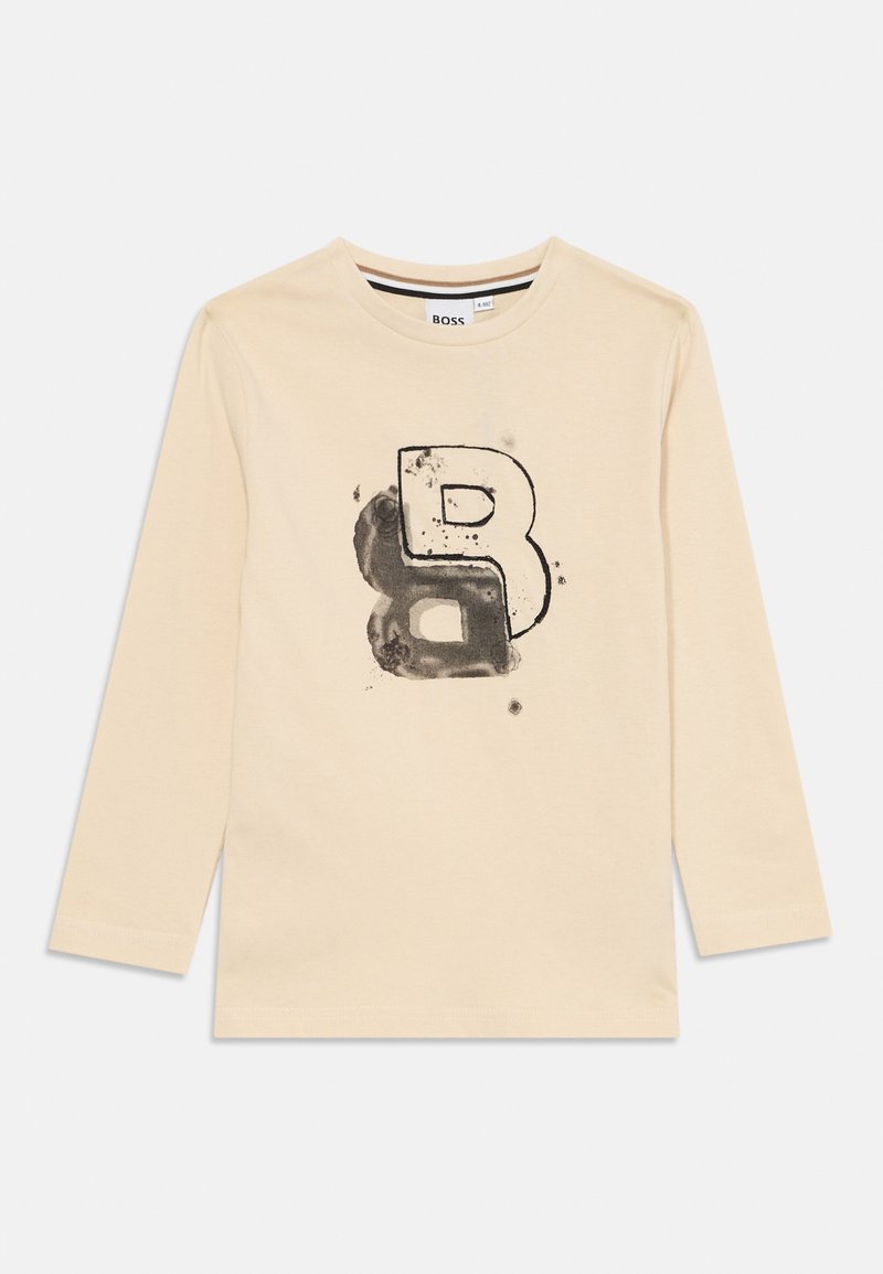 Beige langermet skjorte i myk bomull med trykt svart stilisert bokstav "B" og subtile sprutdetaljer foran.
