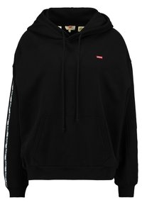Sudadera negra con cordones, bolsillo frontal y detalle del logotipo. Presenta una marca de rayas blancas a lo largo de las mangas. Fabricada con tejido suave.