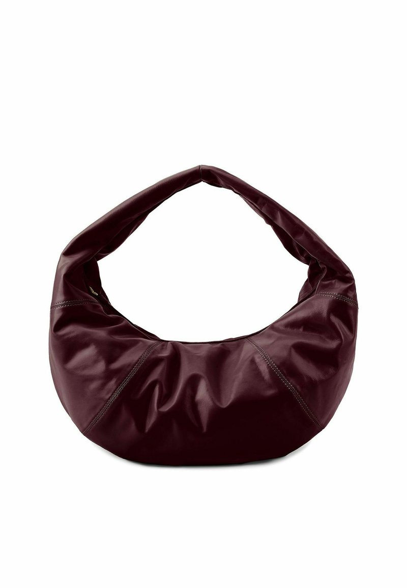 Sac en cuir bordeaux au forme décontractée, avec une large poignée arrondie et des détails de couture subtils. Texture lisse et design épuré.