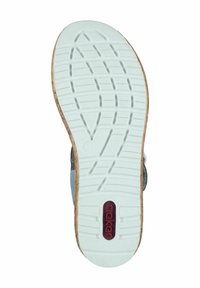 Semelle de sandale en caoutchouc blanc texturé, avec un bord en liège et le logo rouge "rieker", présentant un motif en grille pour l'adhérence.