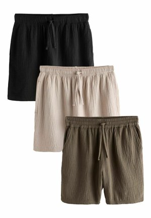 Drei Paare kurzer Hosen aus knitterigem Stoff in Schwarz, Beige und Oliv, jeweils mit elastischem Bund und Kordelzug.