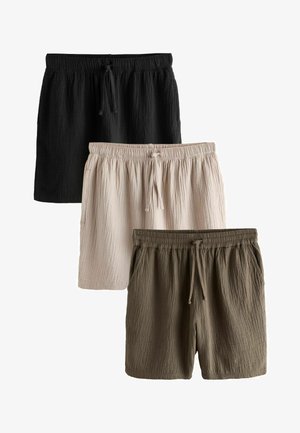 Drei Paare kurzer Hosen aus knitterigem Stoff in Schwarz, Beige und Oliv, jeweils mit elastischem Bund und Kordelzug.