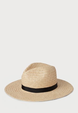 Straw hat with a wide brim and a black ribbon band. Light beige color with a woven texture, featuring a slightly creased crown.