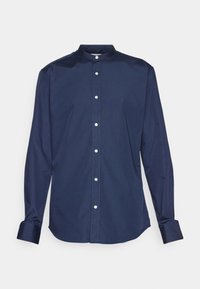 Mörkblå knapp-up skjorta med ståkrage, långa ärmar och vita knappar. Slät textur med en figurnära design och rundad nederkant.