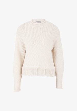 Knit sweater in cream with a textured weave, round neck, and long sleeves. Features a fringe hem detail at the bottom edge.