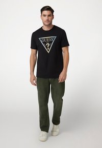 Guess Marškinėliai su spaudiniu - schwarz