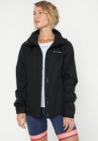 Black waterproof jacket with a zip front, adjustable hood, and elastic cuffs. Paired with blue shorts featuring red stripes at the hem.