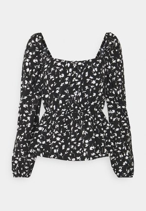Zwarte blouse met wit bloemmotief, vierkante halslijn, lange pofmouwen en een aangezette taille voor extra vorm. Gemaakt van lichtgewicht stof.