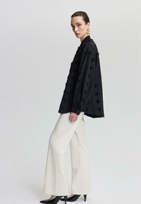 Touché Privé Bomber Jacket - black