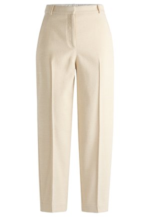 Beige textured trousers with a ribbed pattern, featuring a high waist, pleats, and straight legs. Closed with a zipper and button.