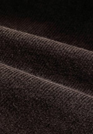 Dark brown fabric with a soft texture, featuring ribbed patterns and subtle fuzziness, laid in folds to showcase depth and material quality.