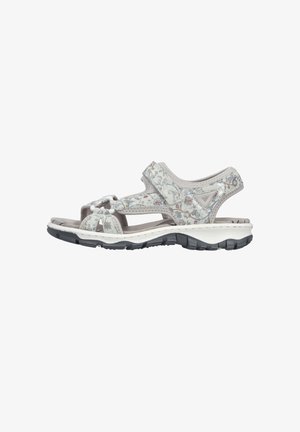 Women's athletic sandal with floral pattern, adjustable straps, cushioned footbed, and durable textured rubber sole shown from side.