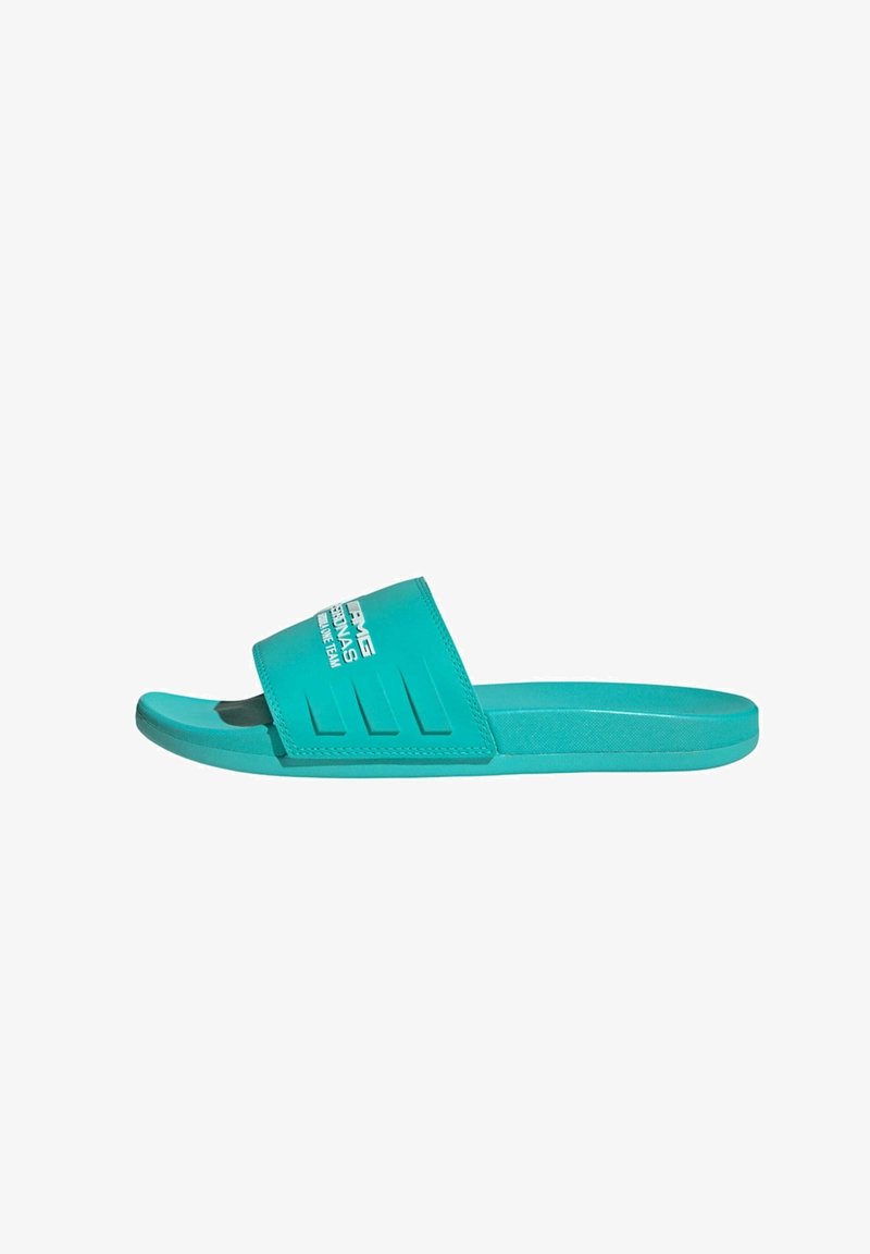Turkise rutsjesandaler lavet af syntetisk materiale, med en bred rem med et tekstureret design og logo samt en flad sål.