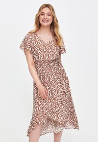 Braun- und weiß gemustertes Kleid mit kurzen, Rüschensleeves, V-Ausschnitt, tailliertem Bund und asymmetrischem Saum. Leichter, fließender Stoff.