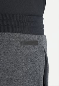 Under Armour Teplákové kalhoty - black