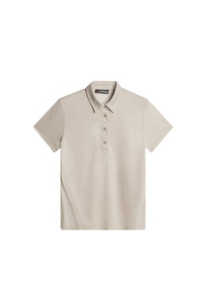 Beige kortärmad polo med ett texturerat mönster, krage och fyra bruna knappar fram. Slät tygfinish.