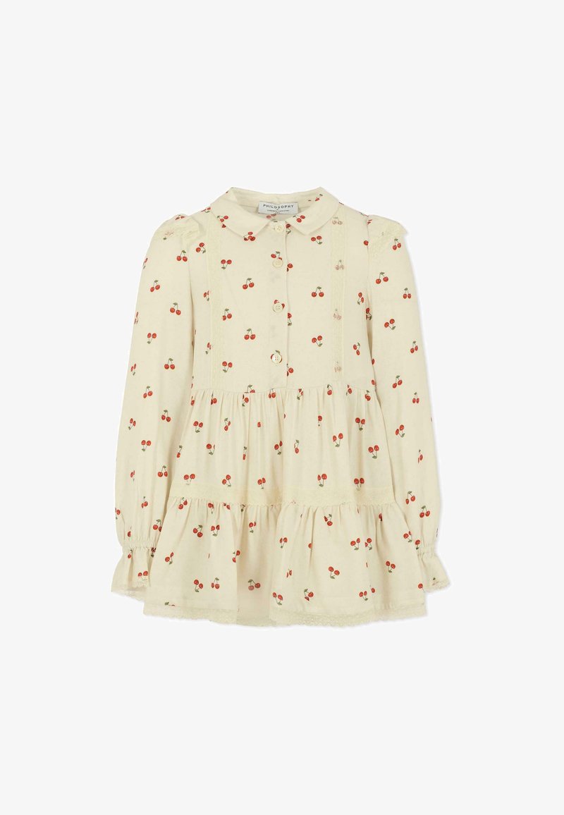 Jasnokremowa sukienka z długim rękawem i kołnierzykiem, zdobiona nadrukiem wiśni, z falbankami na ramionach i warstwowym dołem. Zapięcie na guziki z przodu.