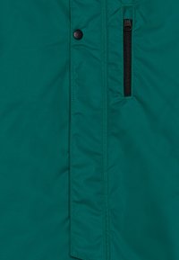 Reima WINTER OVERALL KAUNISTO UNISEX - Zimná kombinéza - deeper green