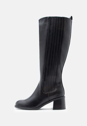 Black knee-high boots made of smooth leather, featuring vertical stitching and a block heel, with a rounded toe and clean design.