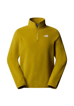 Gul fleece-tröja med kvartsgång i halsen. Har en liten vit logotyp på vänster bröst och en slät, mjuk textur.