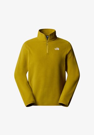 Gelber Fleece-Pullover mit einem Viertelreißverschluss am Hals. Er hat ein kleines weißes Logo auf der linken Brust und eine glatte, weiche Textur.