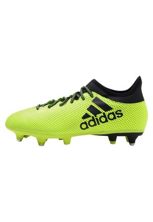 Fotbalové kopačky Adidas v jasné neonově žluté síťovině s černými akcenty, s elegantním designem, šněrováním a tvarovanými kolíky pro lepší přilnavost.