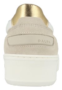 Sneaker with a beige suede body and gold leather heel accent. White sole with textured bottom and a branded panel on the back.