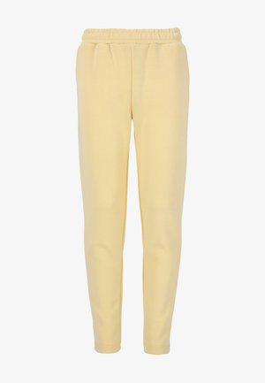 Gula joggerbyxor i mjukt tyg med resår i midjan och smalnande ben. Slät textur, inga synliga mönster eller detaljer.