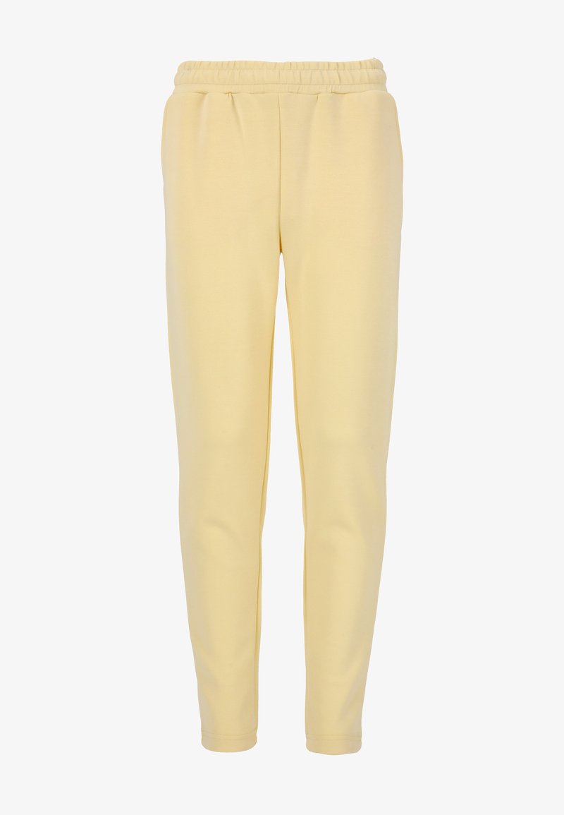 Gula joggerbyxor i mjukt tyg med resår i midjan och smalnande ben. Slät textur, inga synliga mönster eller detaljer.