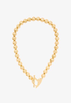 Złota naszyjnik z koralikami w nieregularnych okrągłych kształtach, z zapięciem na zatrzask w kształcie serca.