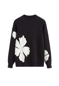 Pull en tricot noir avec de grands motifs floraux blancs à l'arrière et sur les manches, présentant un col côtelé, des poignets et un ourlet.
