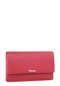 Red leather wallet with a grainy texture, rectangular shape, and a flap closure. Features the brand name "Tamaris" in white on the front.